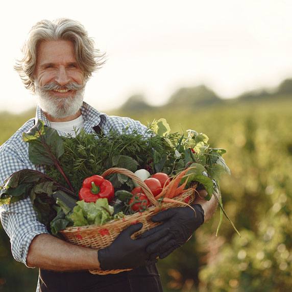 Farmer holding vegetables